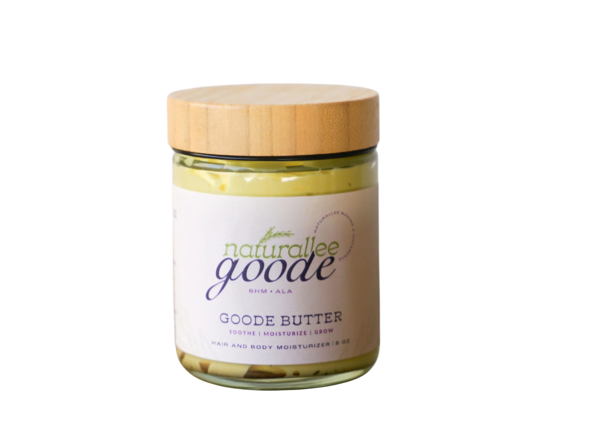 Jar of Goode Butter with a wooden lid on a white background